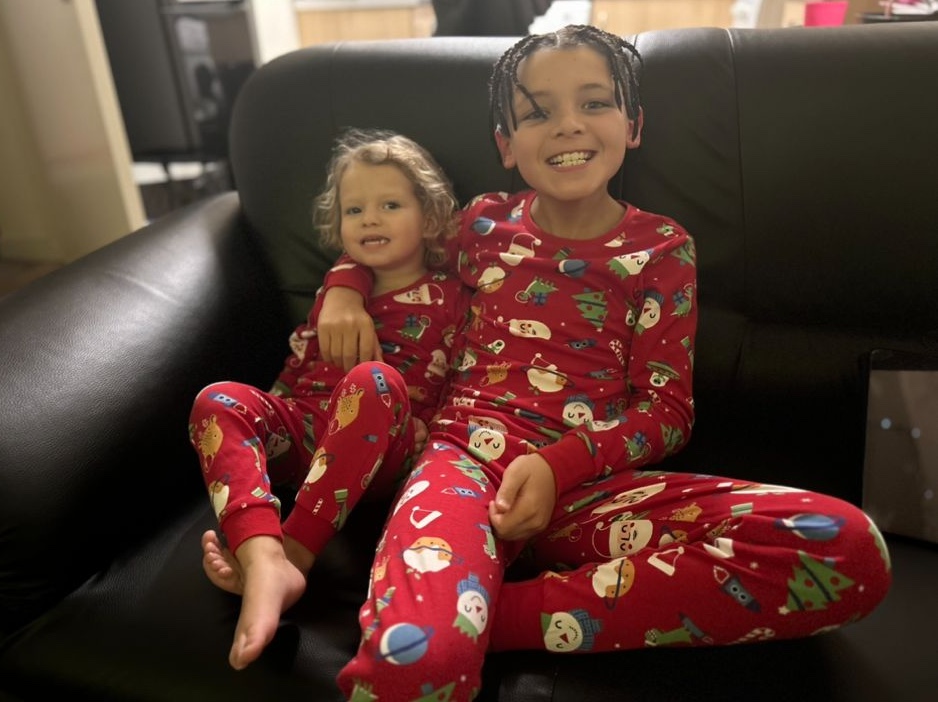 Blake and his sister sitting on a sofa