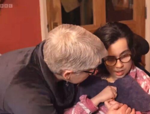 Mother hugging her daughter