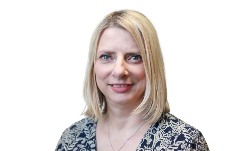 A woman with short blonde hair