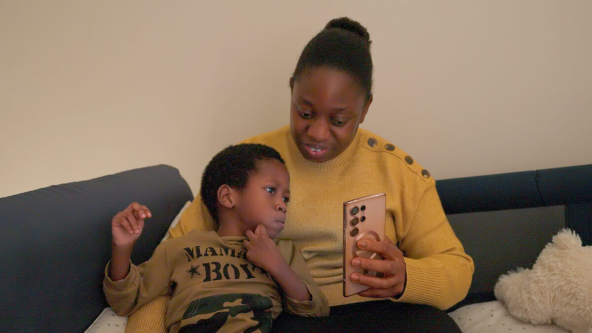 FFD001_WinterCampaign_DanielAbiolaLookingAtPhone