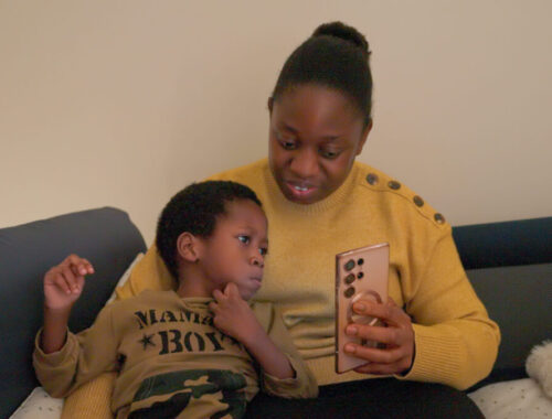 FFD001_WinterCampaign_DanielAbiolaLookingAtPhone