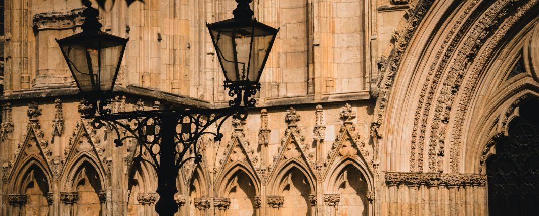 Street light in front of brick archway