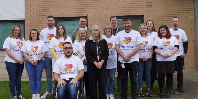 Members of Family Fund staff outside the headoffice building