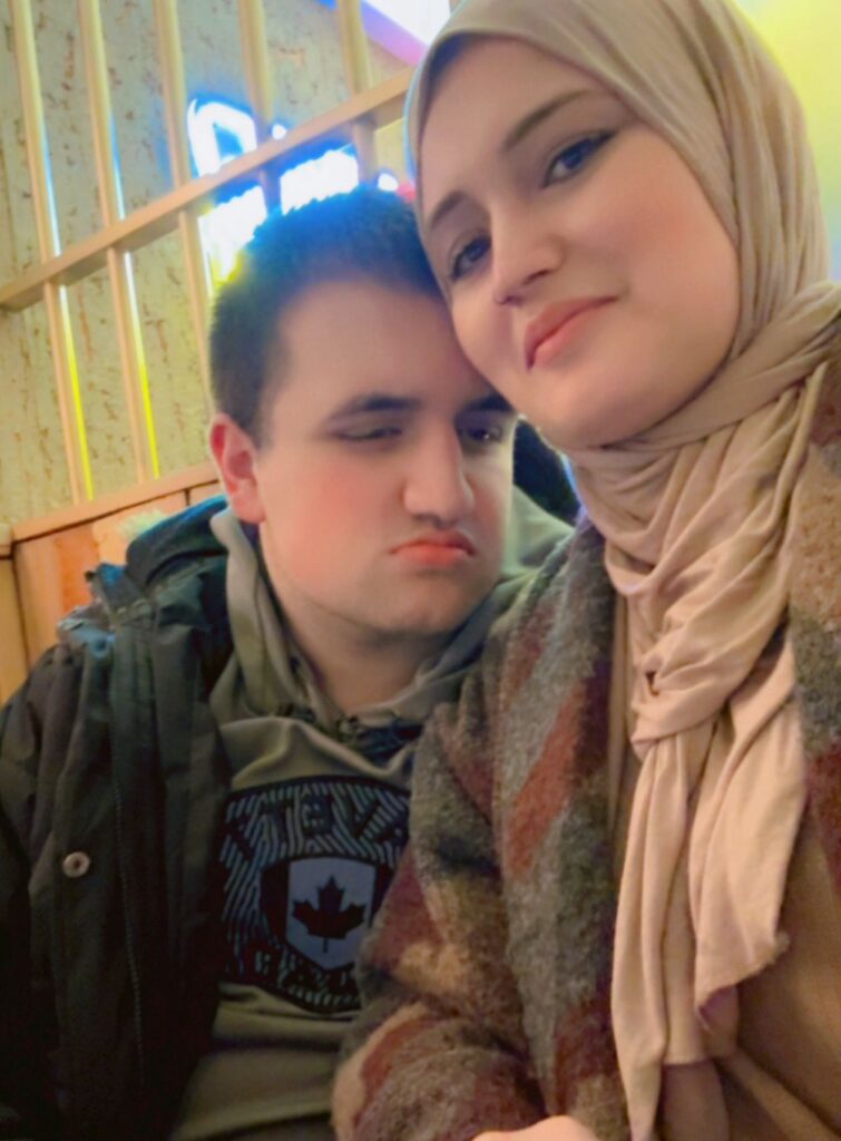 A mother and son sitting together.