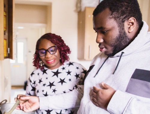 a teenager and his mum cooking together