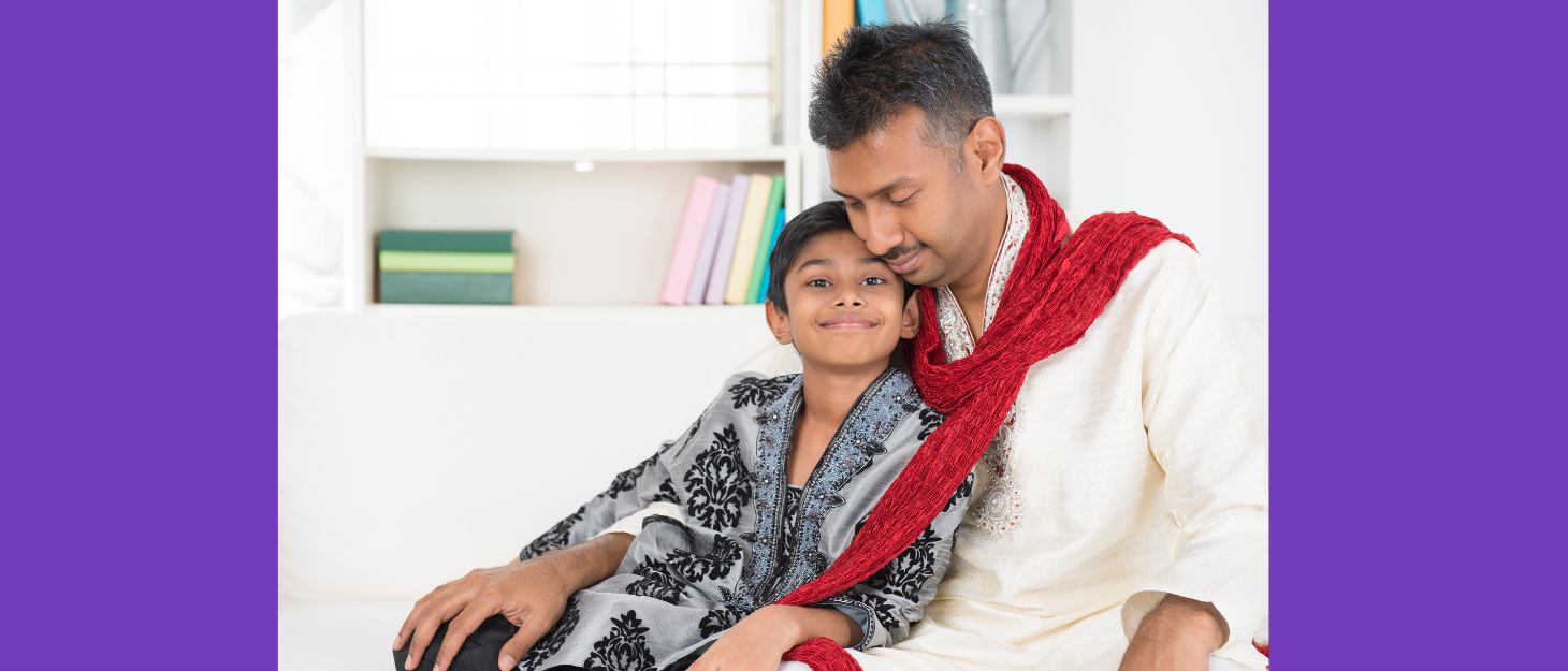 A father holding his smiling son