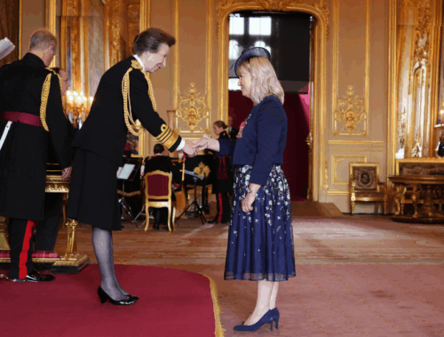 Family Fund CEO, Cheryl Ward is shaking The Princess Royal's hand at the CBE ceremony in Windsor Castle.