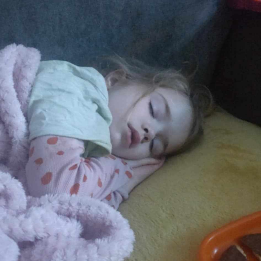 Jessica asleep on the sofa. Mother's Day story.