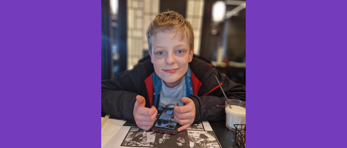 Owain sitting at a restaurant table