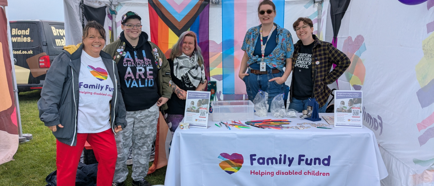 Five Family Fund employees at the Family Fund Pride stall.