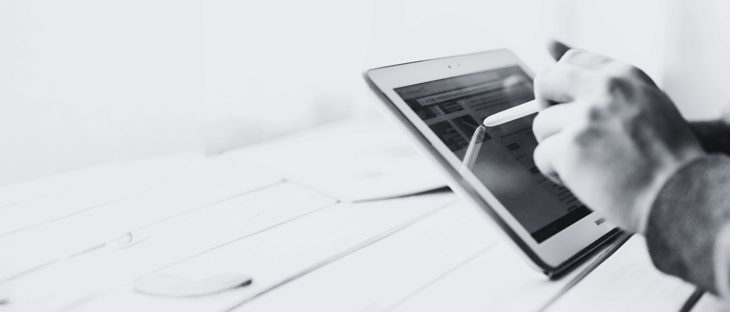 a person using a magic pen on a tablet