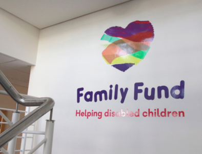 the family fund logo on a white wall in the office headquarters