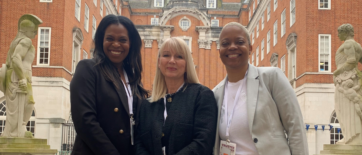 Trustees Emma Pinnock and Marguerite Haye stand either side of Family Fund Chief Executive Cheryl Ward